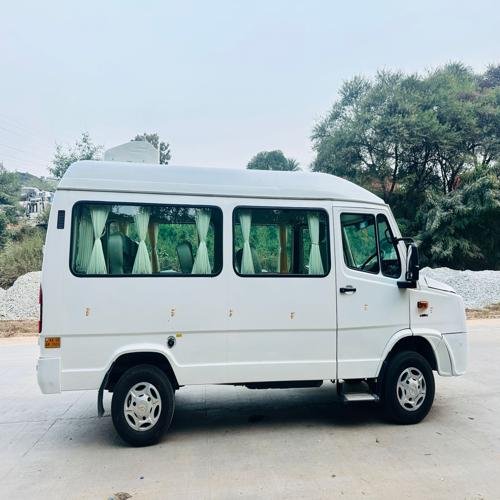Rear exterior view of 9 seater luxury tempo traveller in Bangalore with high roof and premium finish – luxury tempo traveller rent Bangalore