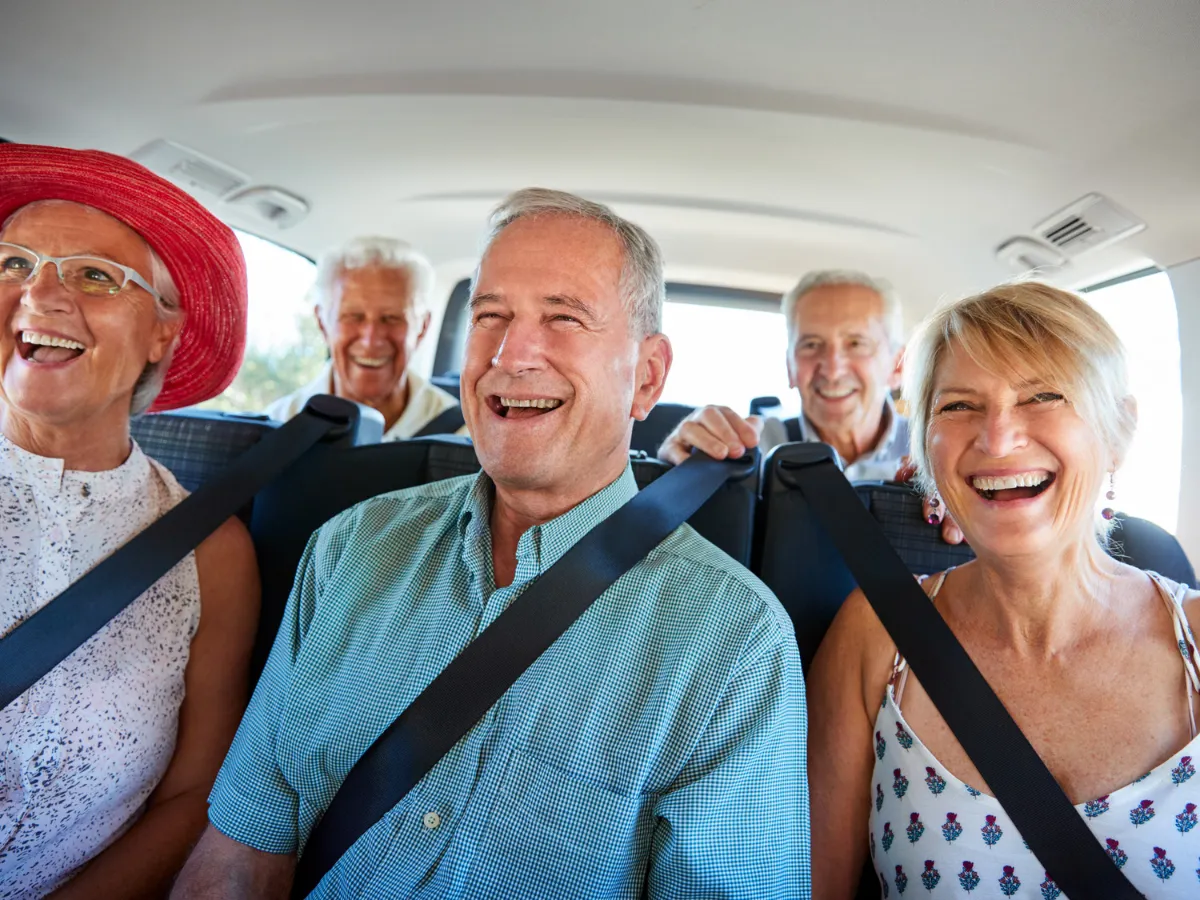Family group enjoying a comfortable van trip from Bangalore